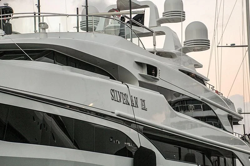 a white yacht with a black seat aboard SILVER ANGEL Yacht for Charter