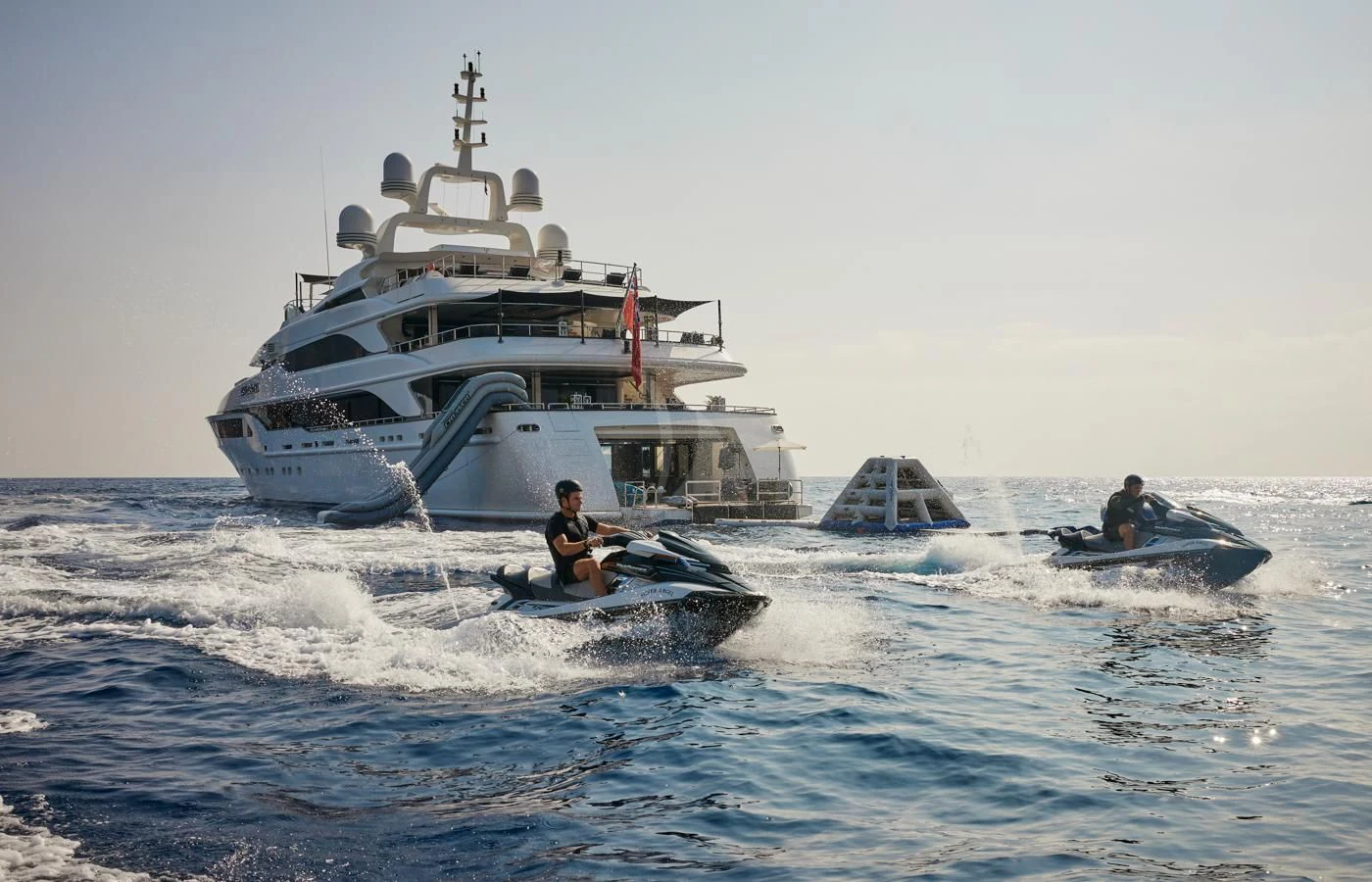 a boat in the water with a couple of people in it aboard SILVER ANGEL Yacht for Charter