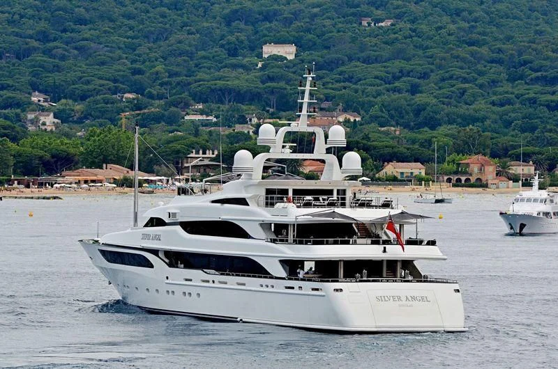 a white yacht in the water aboard SILVER ANGEL Yacht for Charter