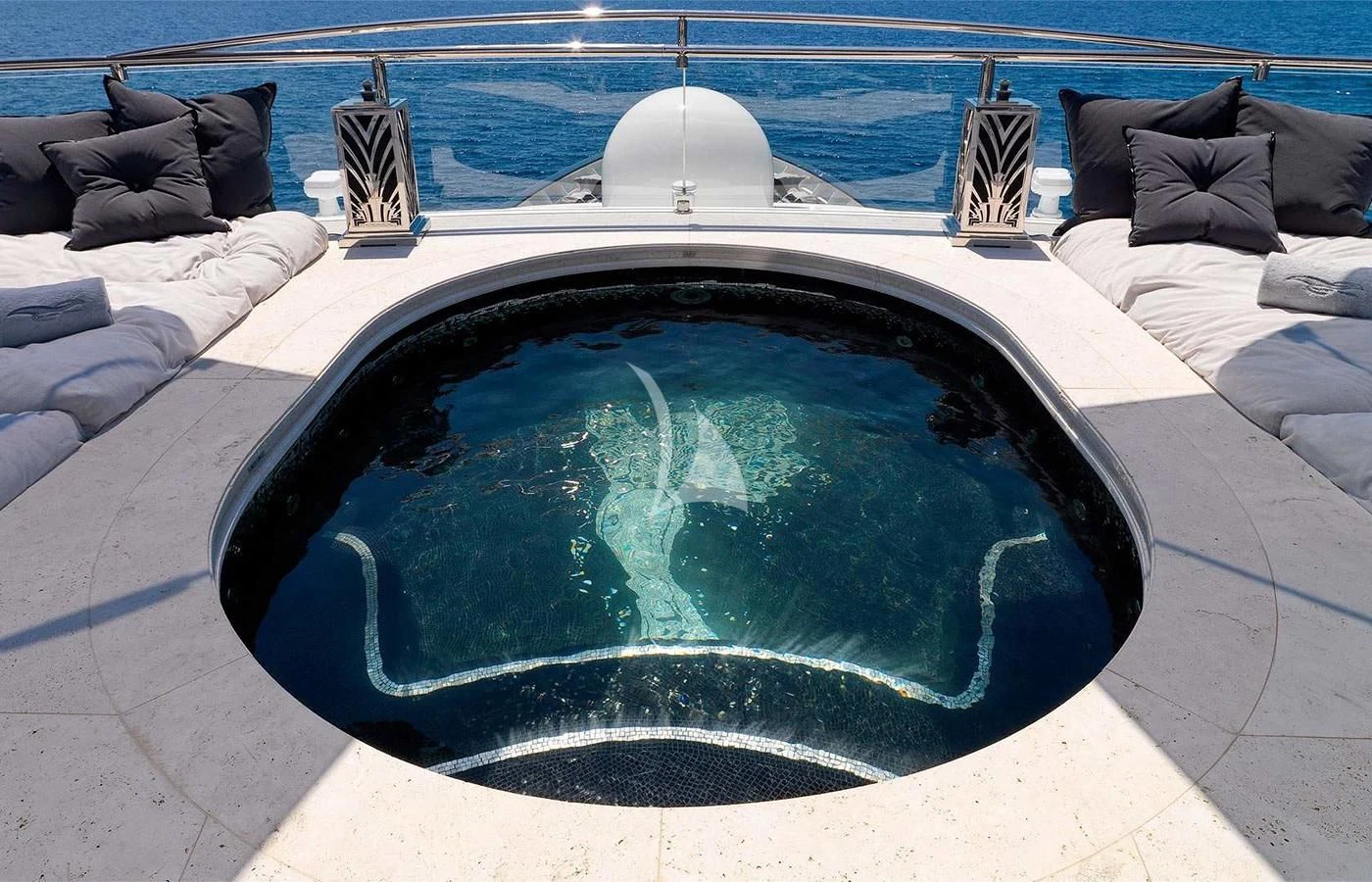 a blue tent with a white tent and a white bed and a white floor with a white tent aboard SILVER ANGEL Yacht for Charter