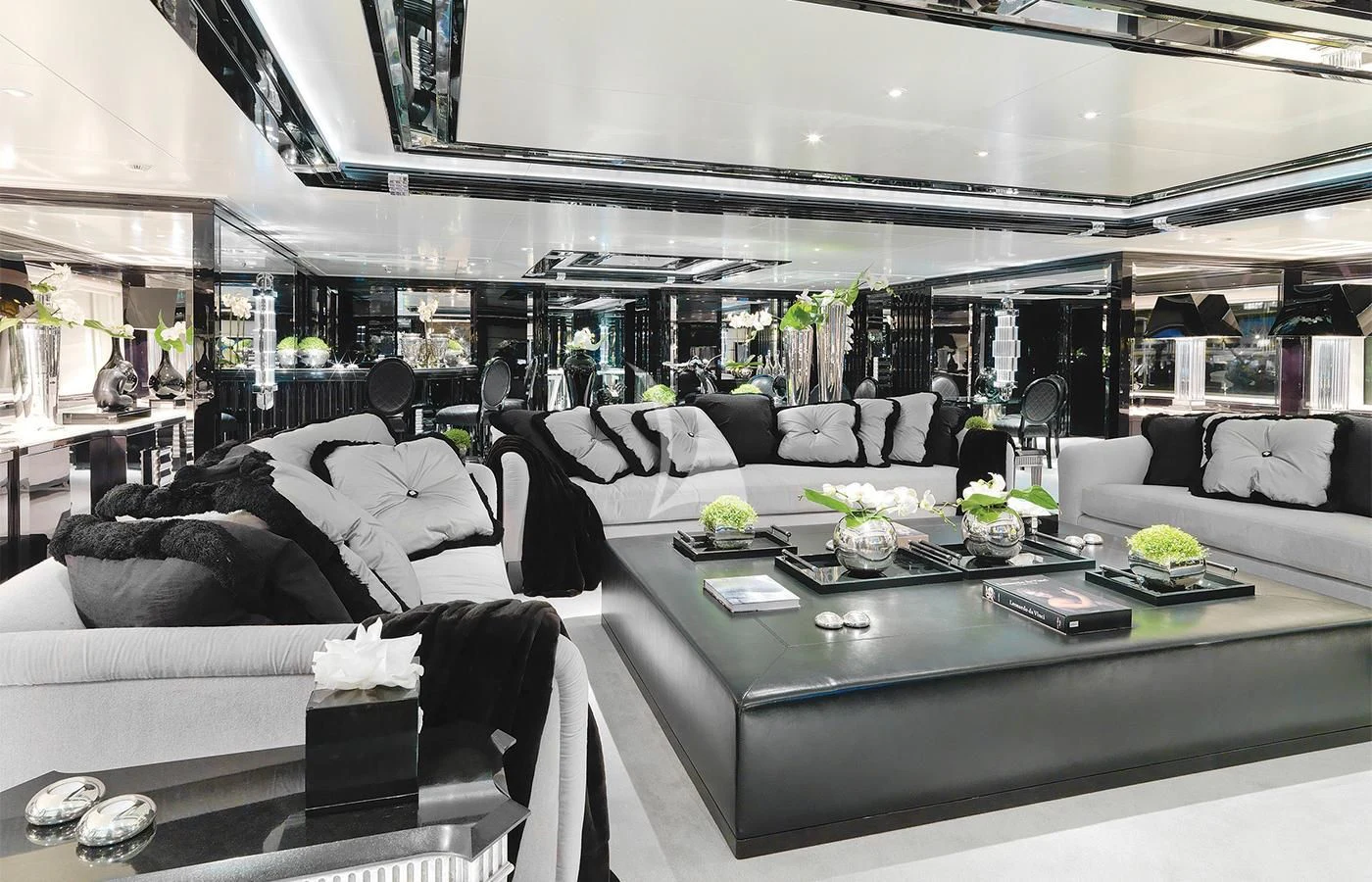 a living room with white couches aboard SILVER ANGEL Yacht for Charter