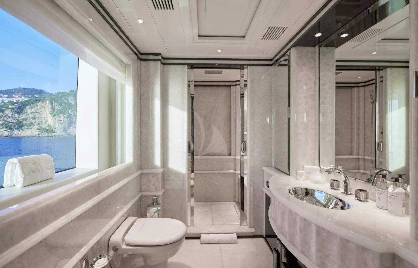 a bathroom with a tub sink and toilet aboard SILVER ANGEL Yacht for Charter