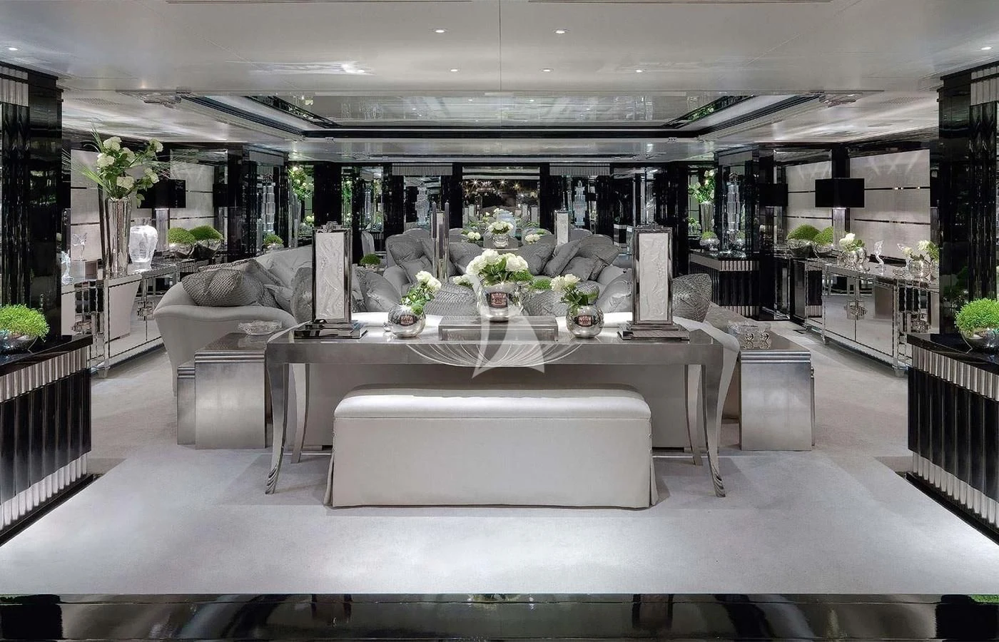 a large room with a table and chairs aboard SILVER ANGEL Yacht for Charter