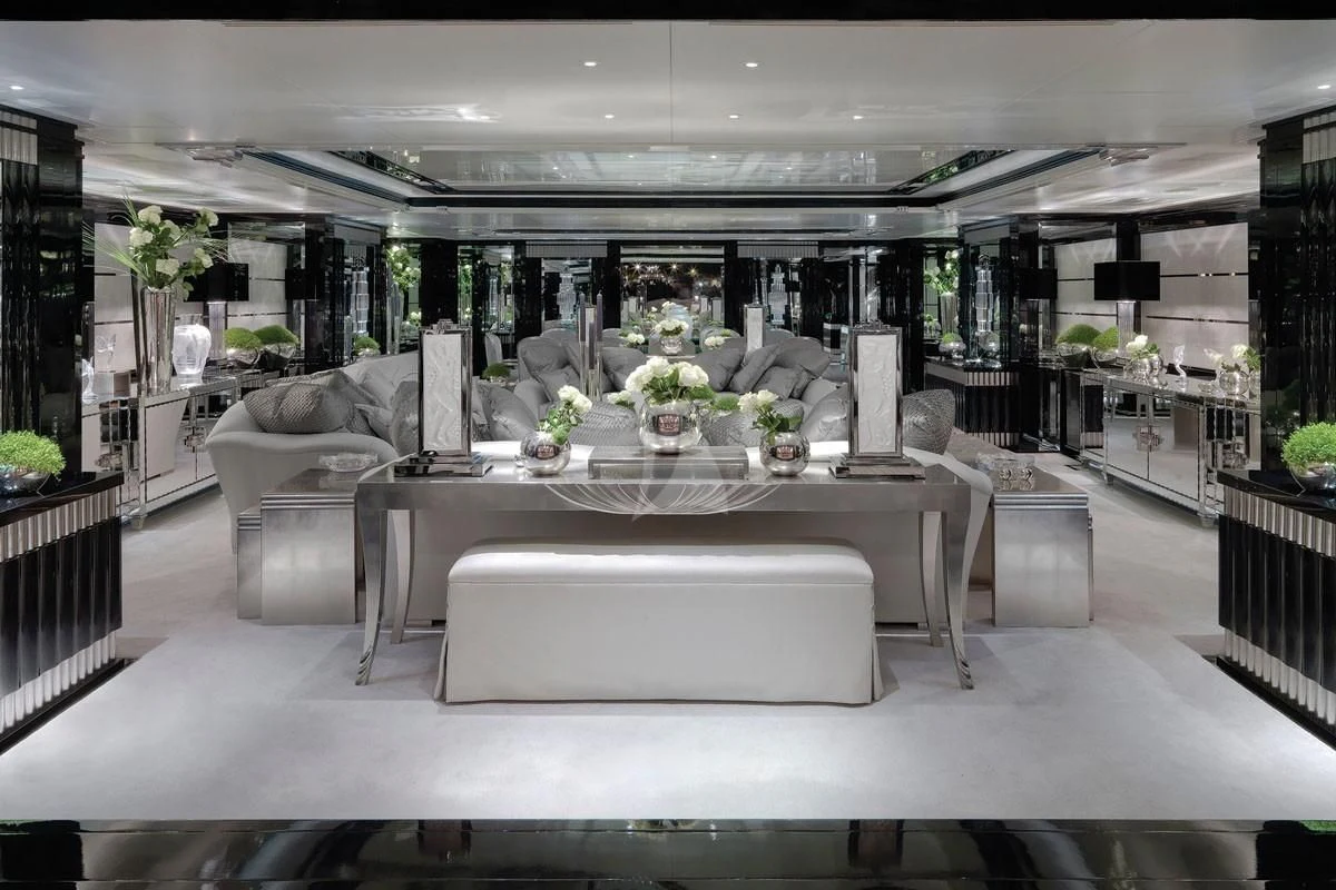 a large room with a table and chairs aboard SILVER ANGEL Yacht for Charter