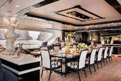 a large room with tables and chairs aboard SILVER ANGEL Yacht for Charter
