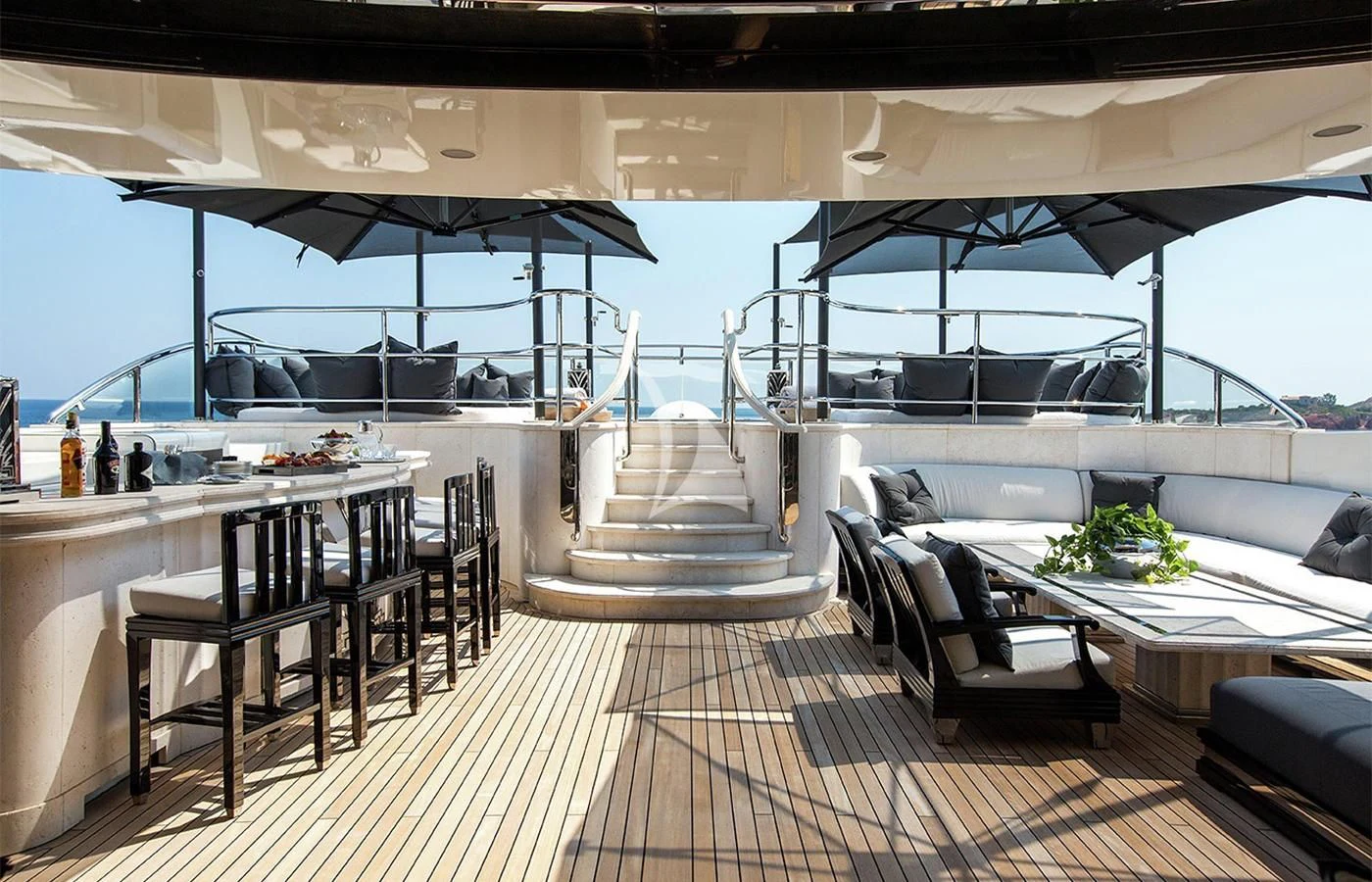a room with a table chairs and a large window aboard SILVER ANGEL Yacht for Charter