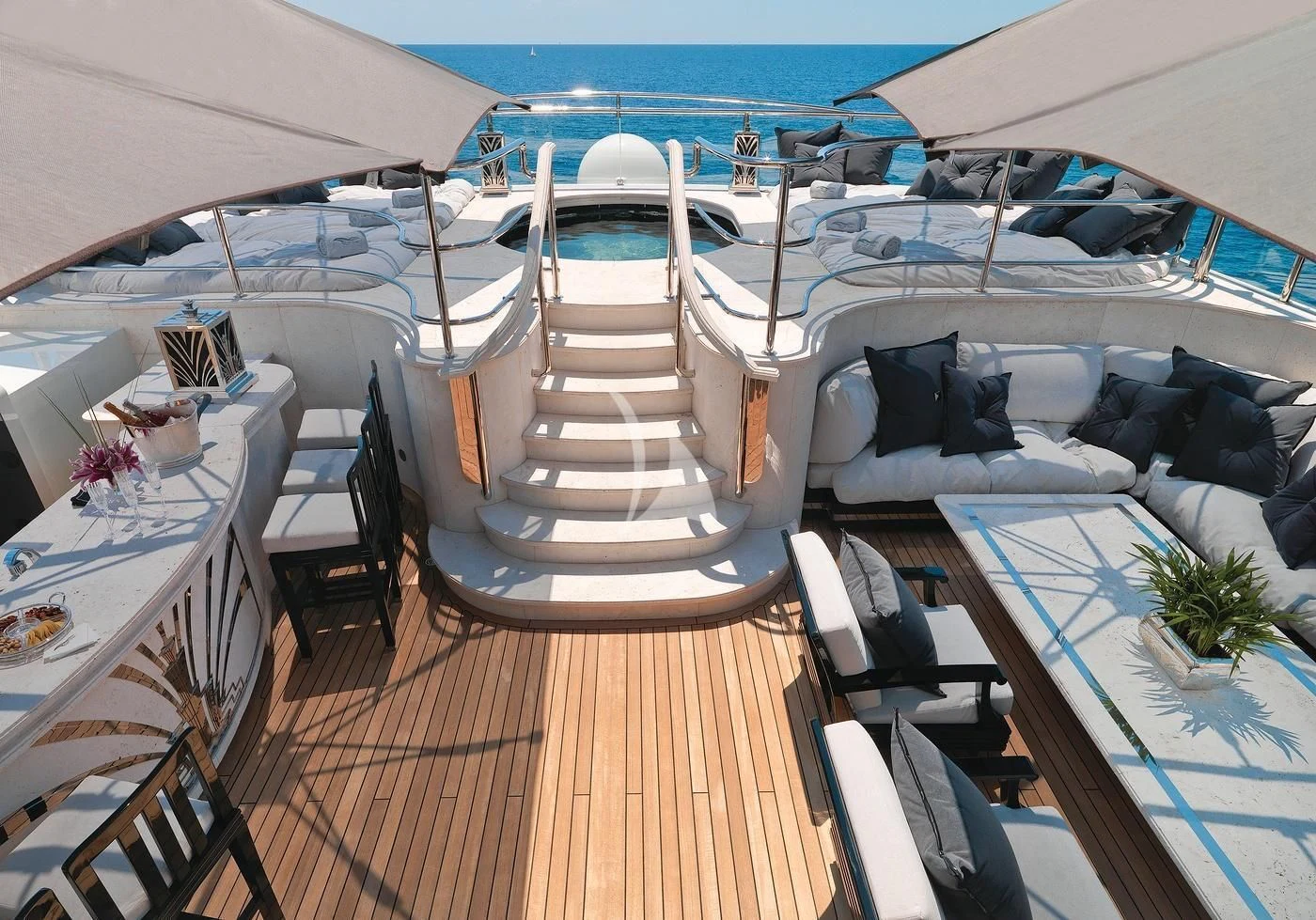 a deck with a large deck and chairs on it aboard SILVER ANGEL Yacht for Charter
