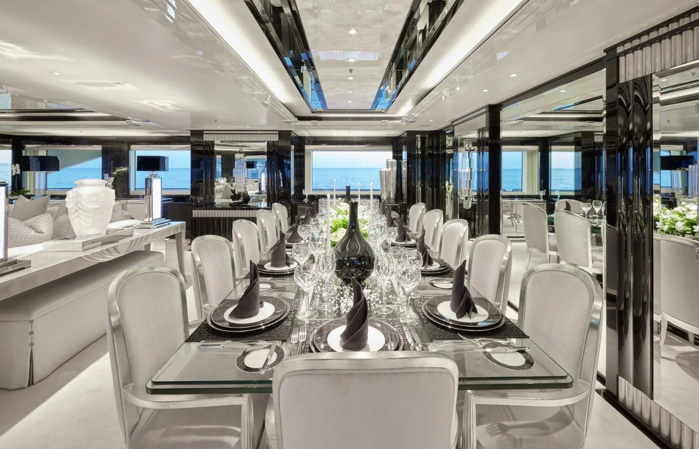 a room with tables and chairs aboard SILVER ANGEL Yacht for Charter