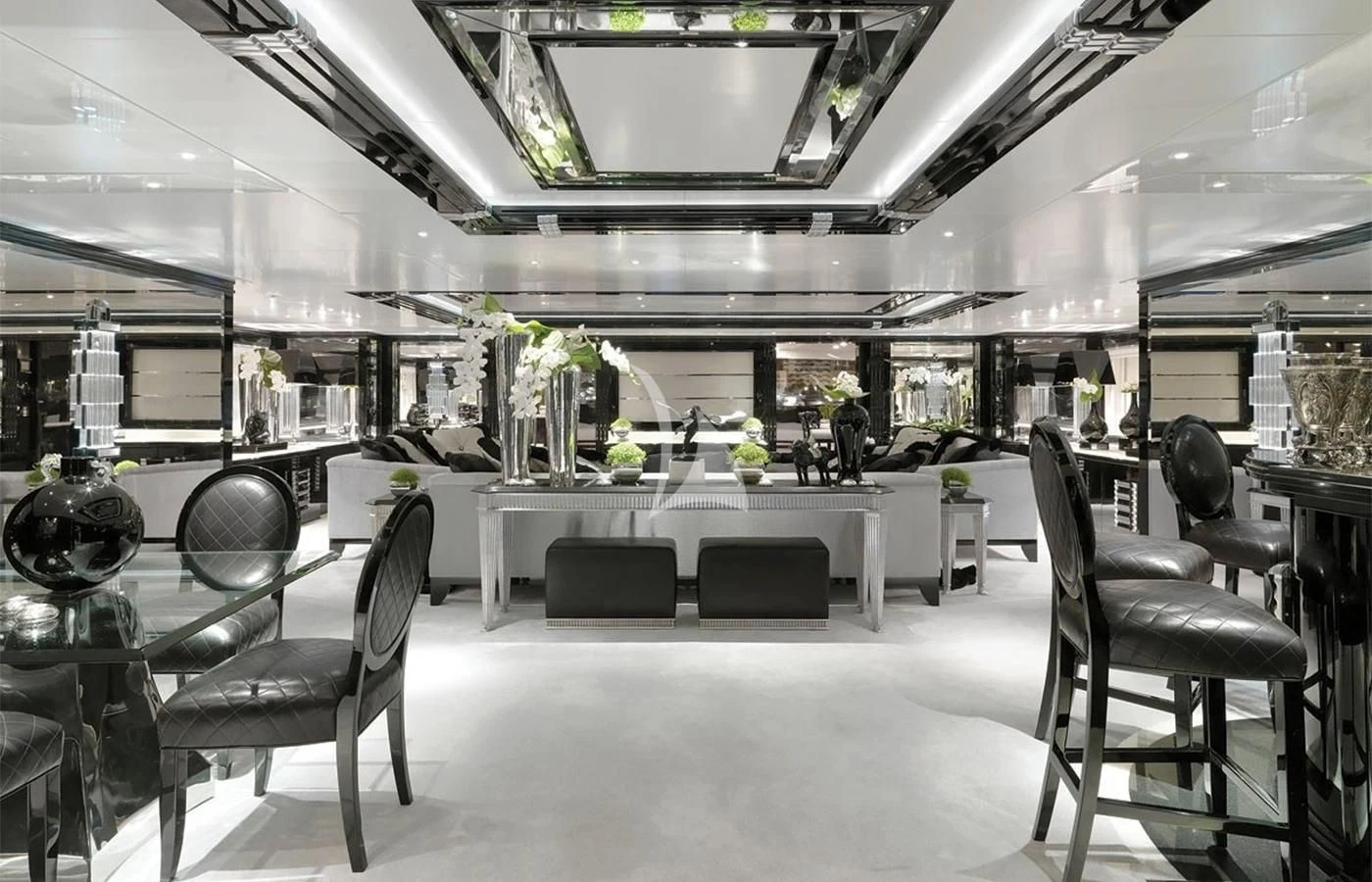 a large room with tables and chairs aboard SILVER ANGEL Yacht for Charter