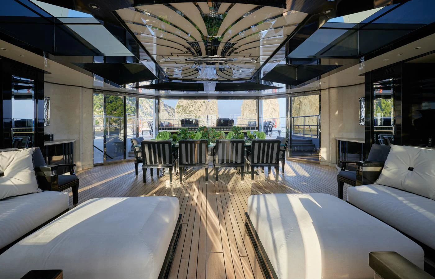 a room with a table chairs and a large window aboard SILVER ANGEL Yacht for Charter
