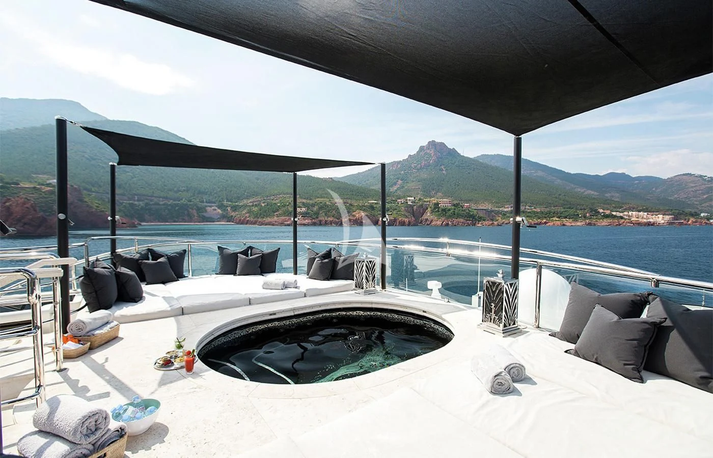 a large bed with a large body of water in the background aboard SILVER ANGEL Yacht for Charter