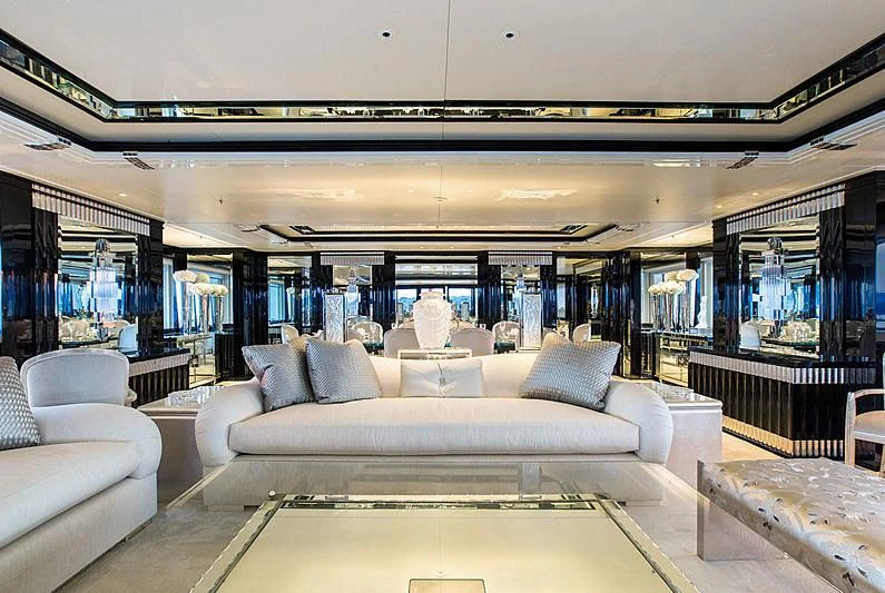 a large room with a couch and a table aboard SILVER ANGEL Yacht for Charter