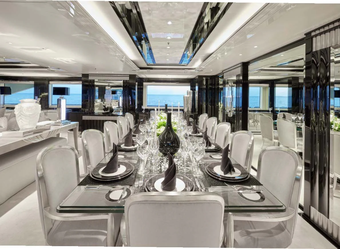 a room with tables and chairs aboard SILVER ANGEL Yacht for Charter