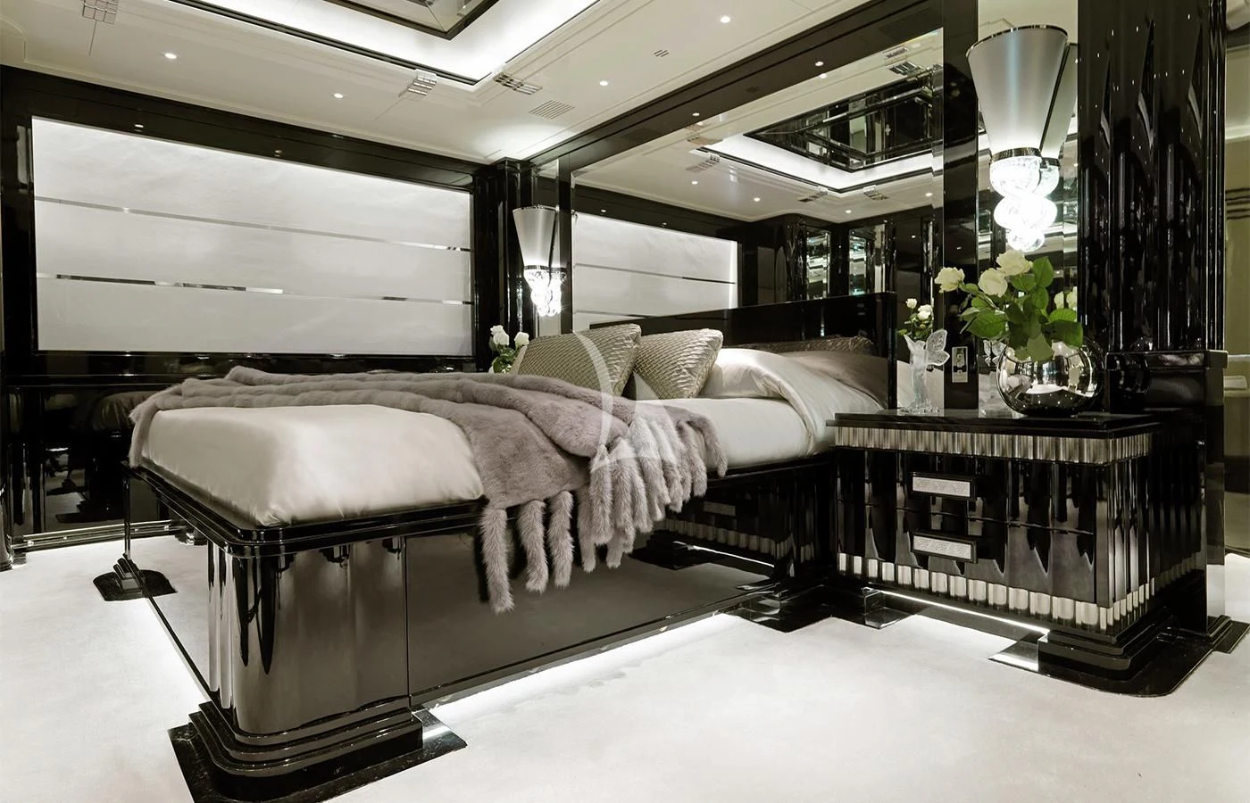 a bedroom with a large bed aboard SILVER ANGEL Yacht for Charter