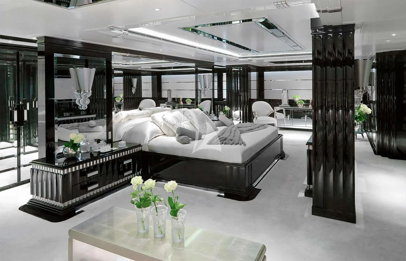 a room with a bed and a table aboard SILVER ANGEL Yacht for Charter