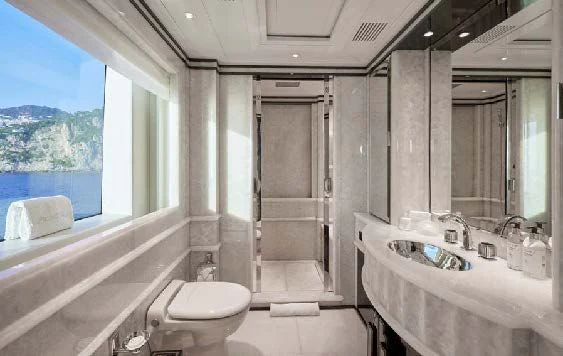 a bathroom with a tub sink and toilet aboard SILVER ANGEL Yacht for Charter