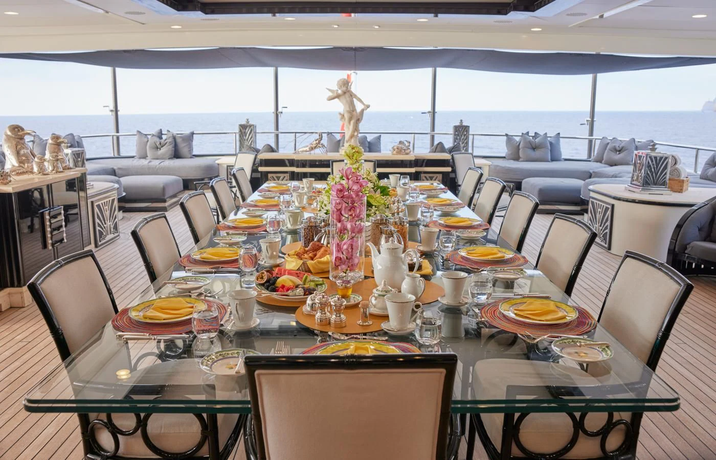a table with plates and cups on it aboard SILVER ANGEL Yacht for Charter