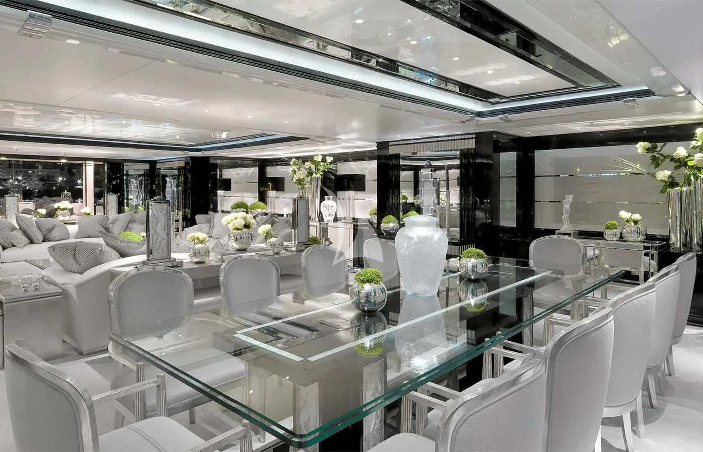 a room with tables and chairs aboard SILVER ANGEL Yacht for Charter