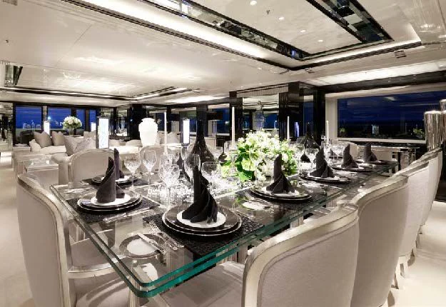 a room with a table and chairs aboard SILVER ANGEL Yacht for Charter