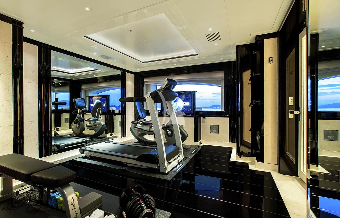 a gym with exercise equipment aboard SILVER ANGEL Yacht for Charter
