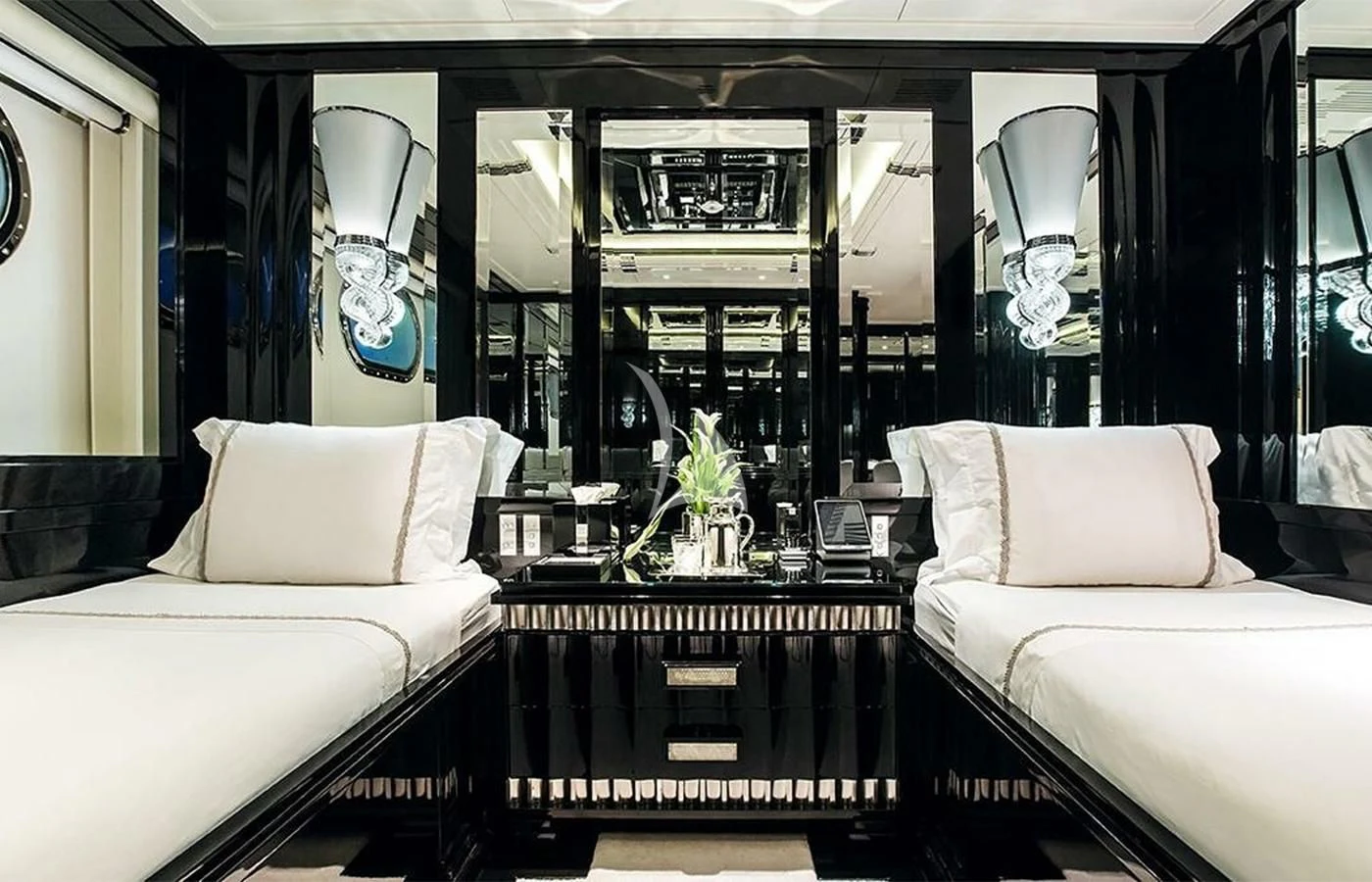 a room with a bed and a table aboard SILVER ANGEL Yacht for Charter