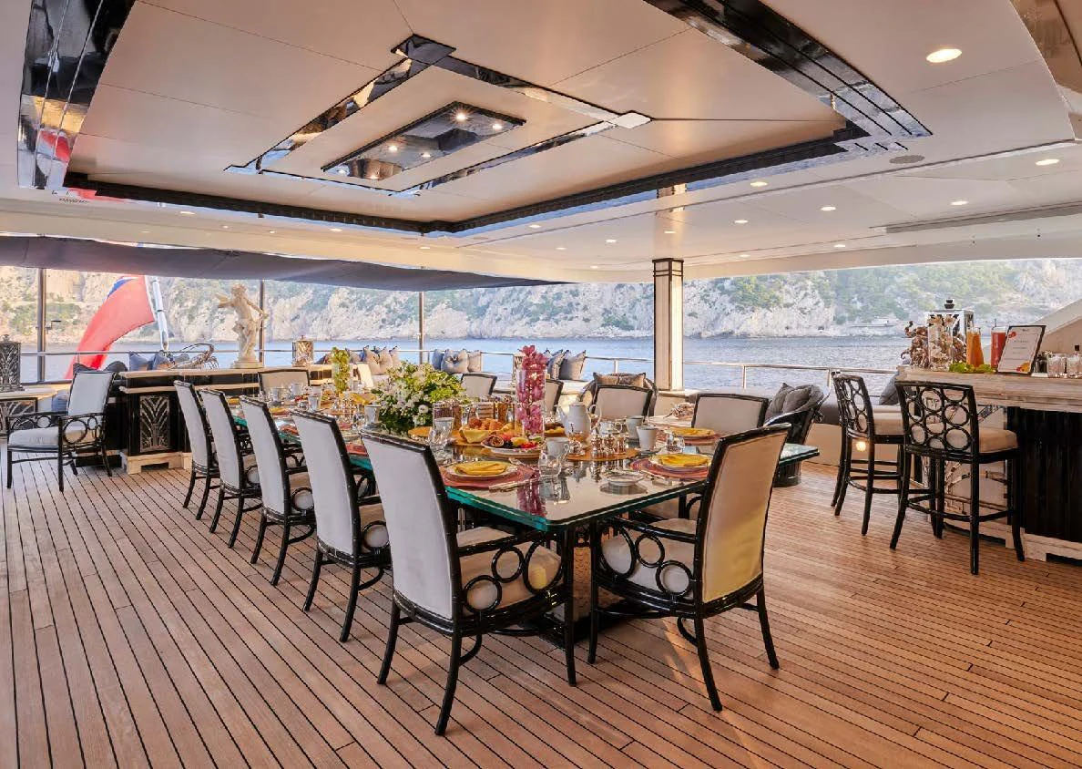 a dining room with a table and chairs aboard SILVER ANGEL Yacht for Charter