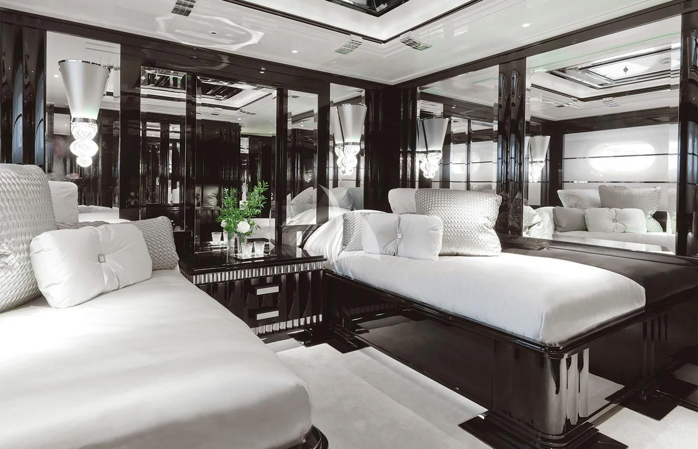 a room with a bed and a table aboard SILVER ANGEL Yacht for Charter