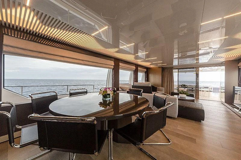 a room with a table and chairs aboard GIO 2 Yacht for Sale