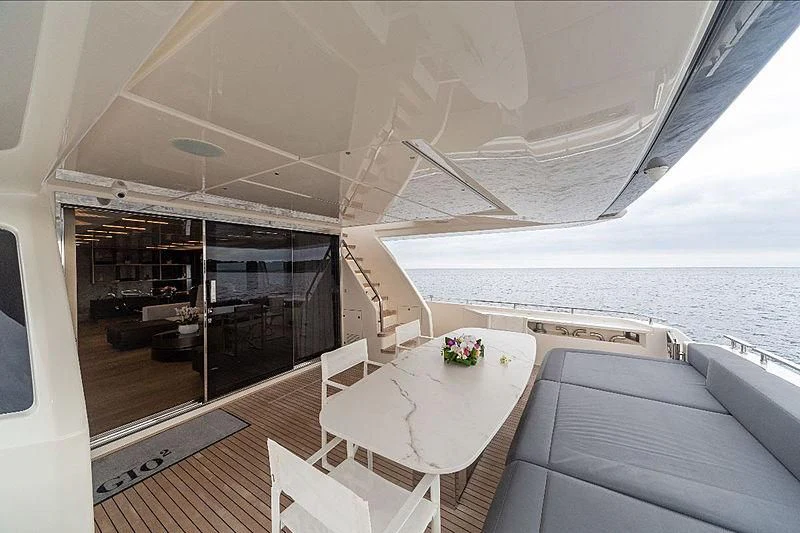 a room with a table and chairs aboard GIO 2 Yacht for Sale