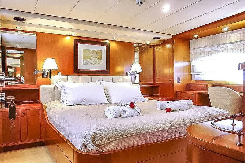 a large bed in a room aboard AMNA Yacht for Sale