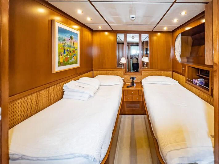 a room with two beds aboard AMNA Yacht for Sale