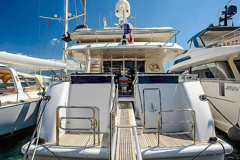a boat docked at a pier aboard AMNA Yacht for Sale