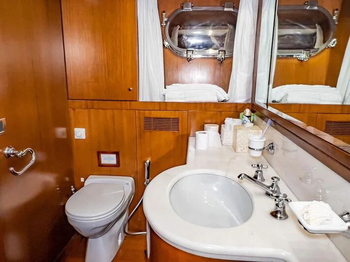 a bathroom with a sink and toilet aboard AMNA Yacht for Sale