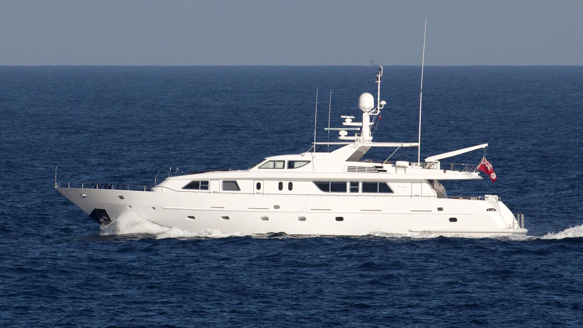 a white yacht in the water aboard AMNA Yacht for Sale