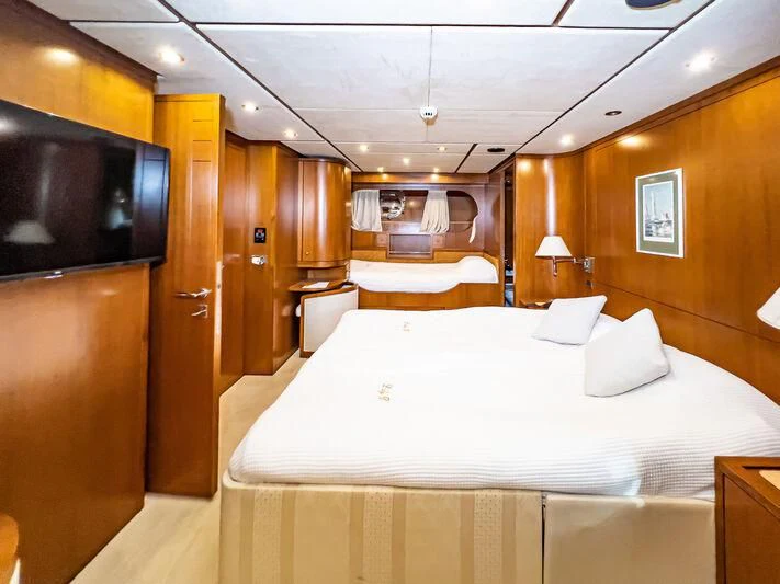 a room with a bed and a tv aboard AMNA Yacht for Sale