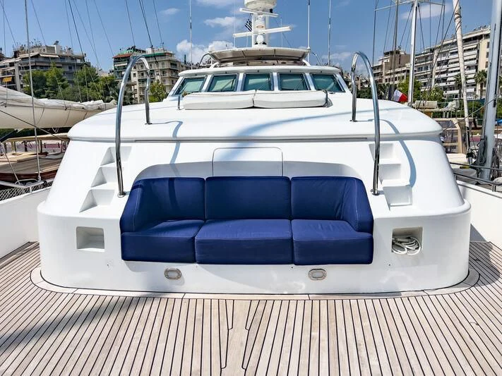 a white boat on a dock aboard AMNA Yacht for Sale