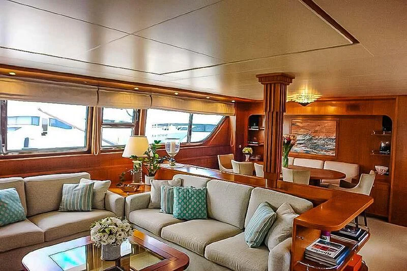 a living room with a couch and a table aboard AMNA Yacht for Sale