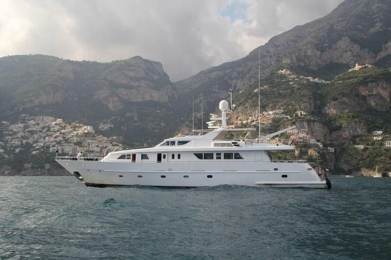 a white yacht on the water aboard AMNA Yacht for Sale