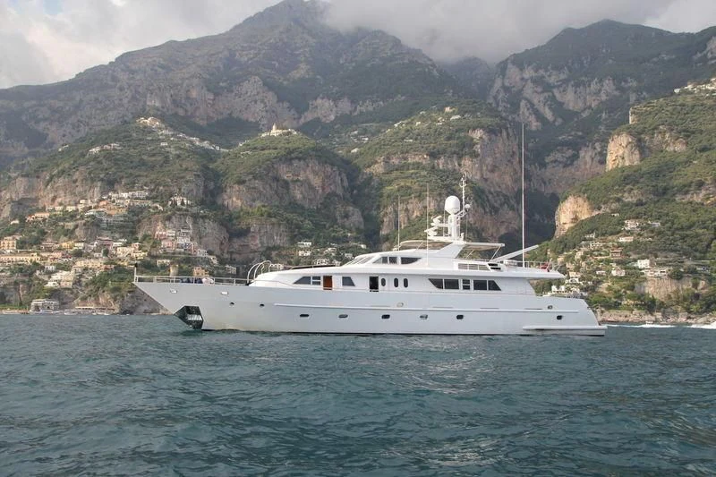 a white boat on water aboard AMNA Yacht for Sale