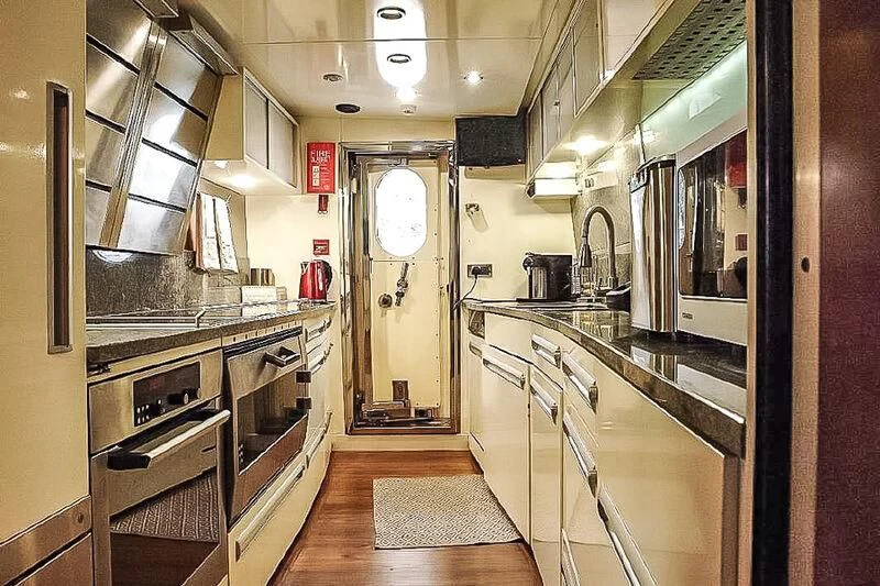 a kitchen with stainless steel appliances aboard AMNA Yacht for Sale