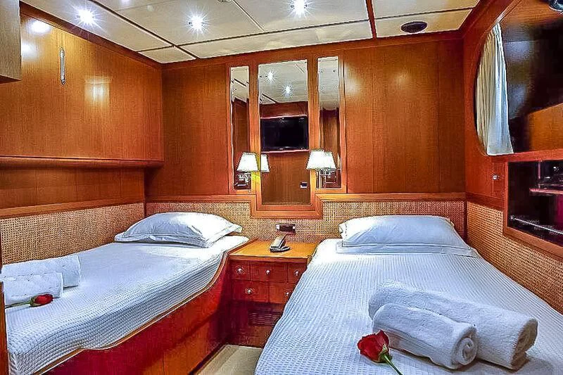 a room with two beds aboard AMNA Yacht for Sale