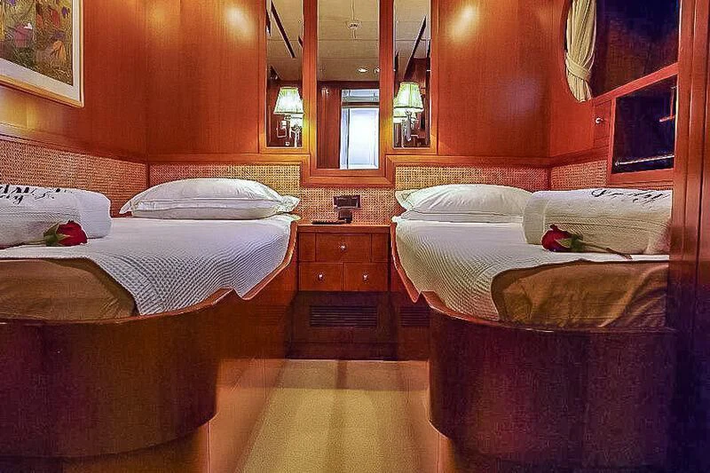 a room with two beds aboard AMNA Yacht for Sale