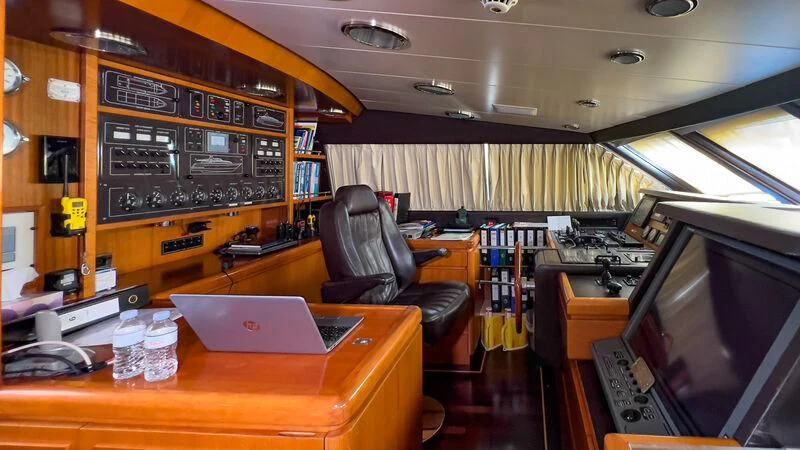 a room with a laptop and a chair aboard AMNA Yacht for Sale