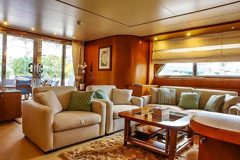 a living room with a couch and a coffee table aboard AMNA Yacht for Sale