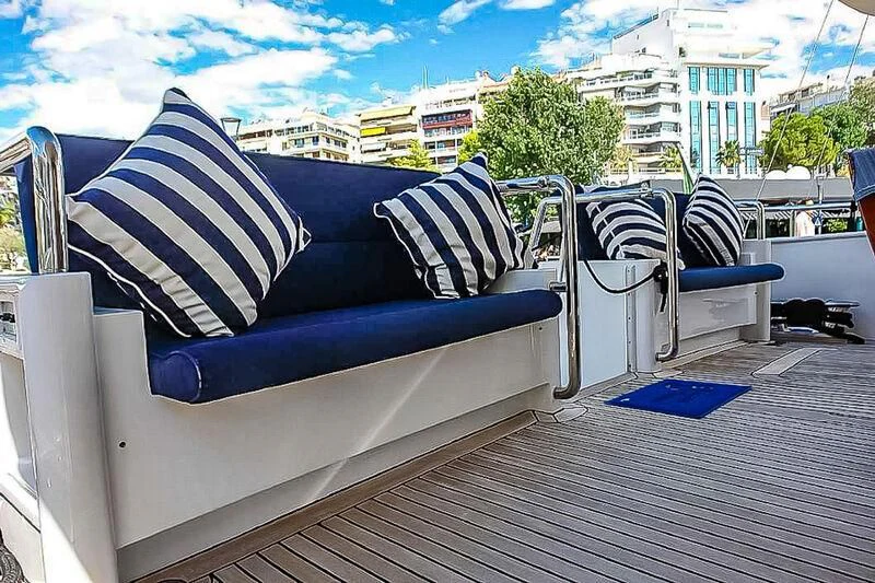 a couch with a blue couch aboard AMNA Yacht for Sale