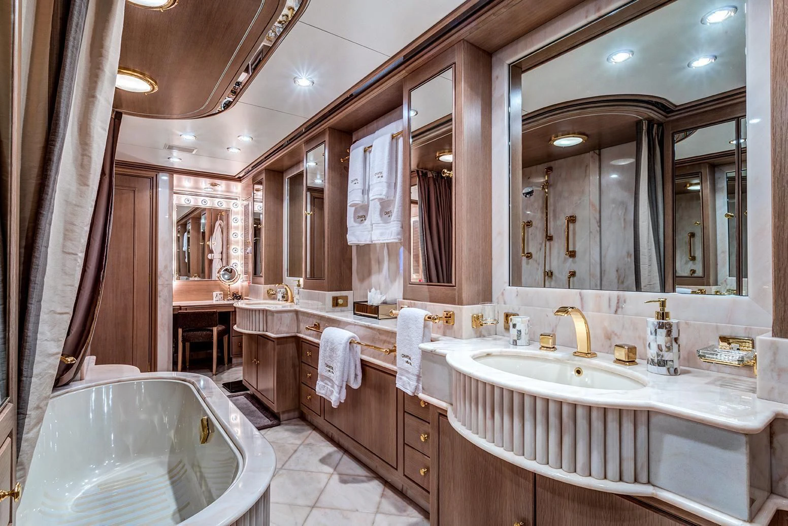 a bathroom with a large mirror aboard CHANTAL MA VIE Yacht for Sale