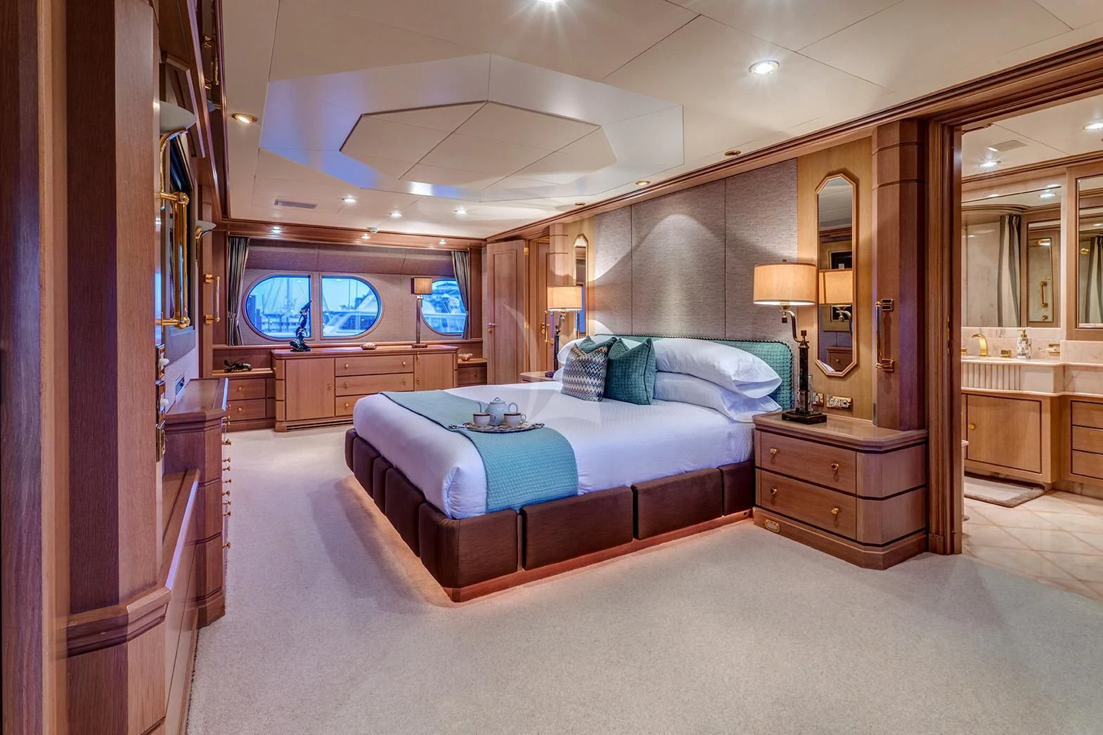 a bedroom with a bed and a mirror aboard CHANTAL MA VIE Yacht for Sale