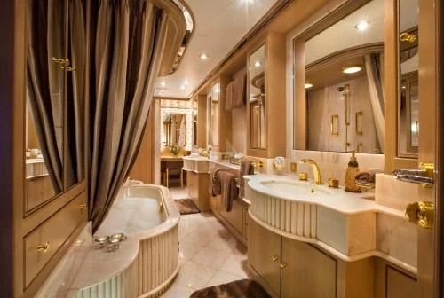 a bathroom with a tub sink and a shower curtain aboard CHANTAL MA VIE Yacht for Sale