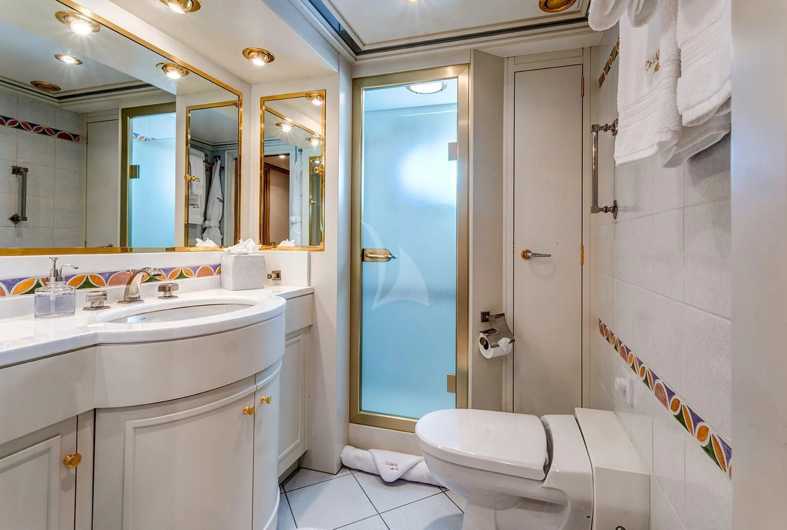 a bathroom with a sink toilet and a mirror aboard CHANTAL MA VIE Yacht for Sale