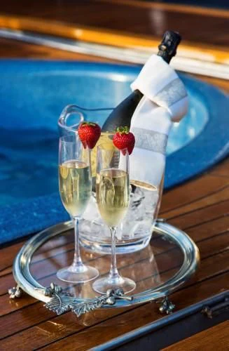 champagne glasses with strawberries and champagne aboard CHANTAL MA VIE Yacht for Sale